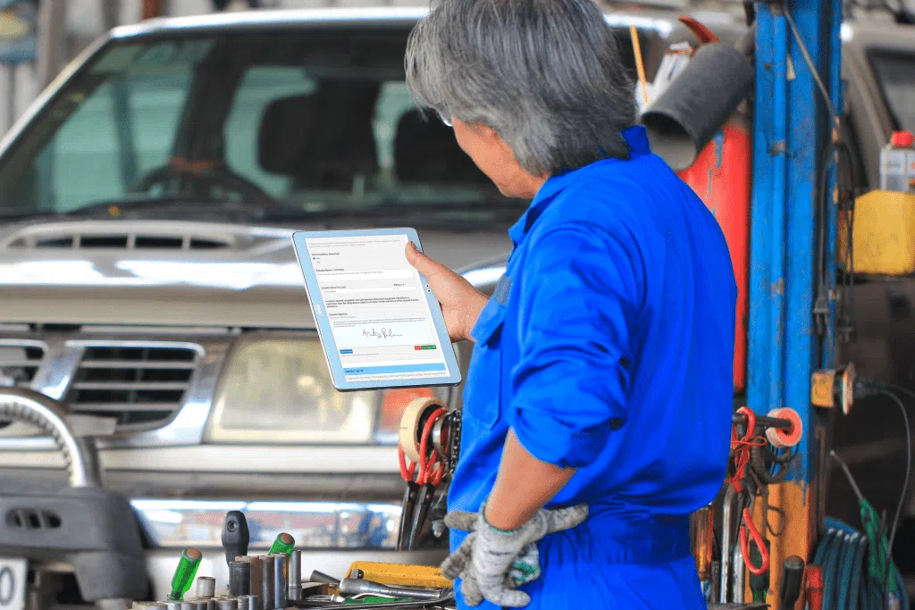 A man using customizable safety forms on his tablet | Corrective Action Software