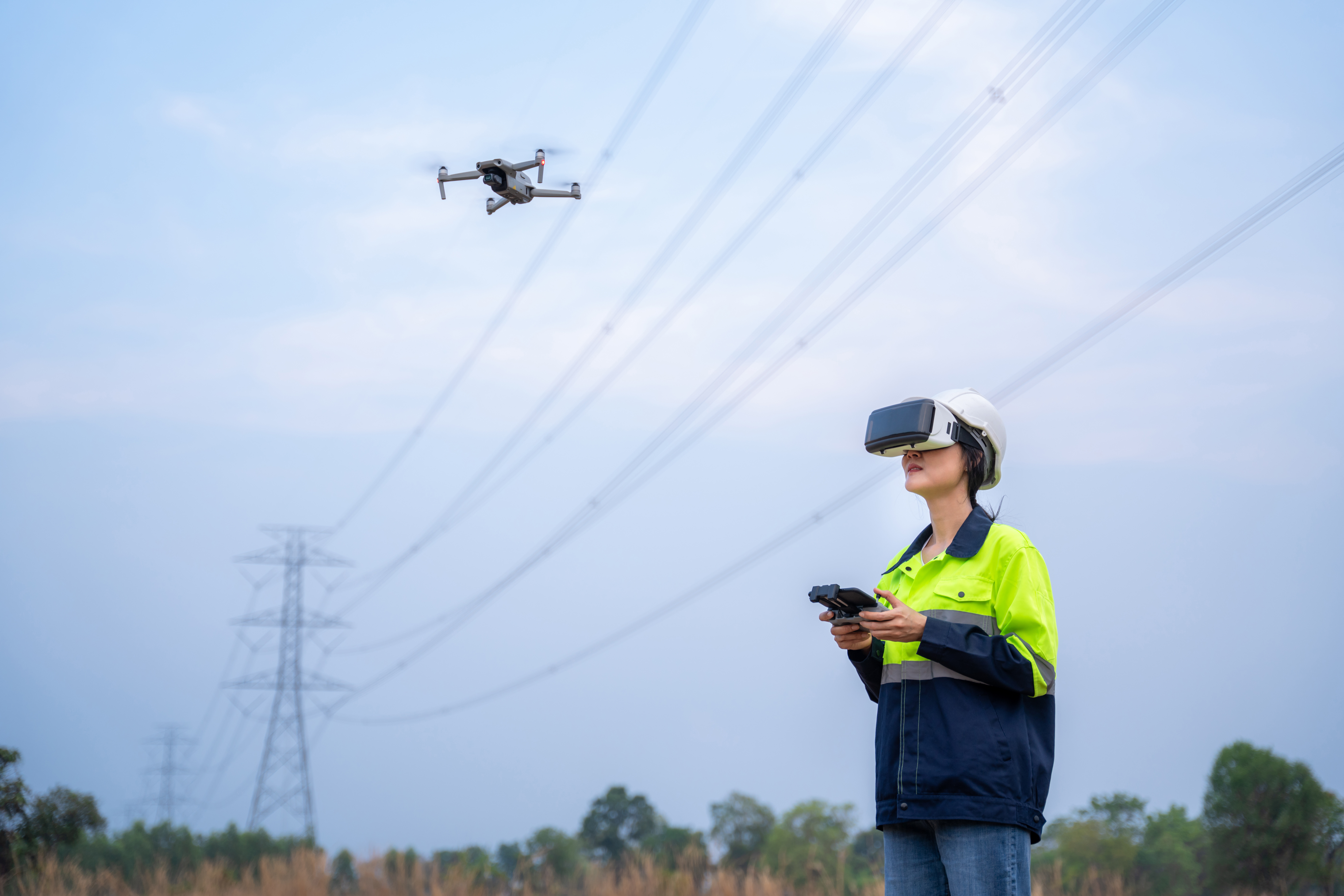 A Women flying a drone at a construction site, portraying the use of technology