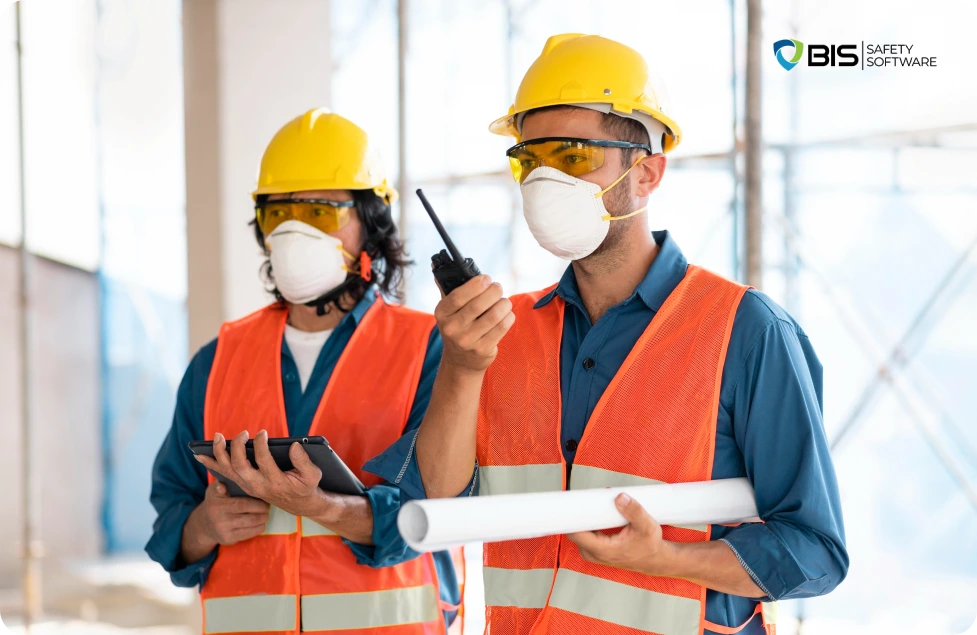 Two employees communicating through walkie-talkies