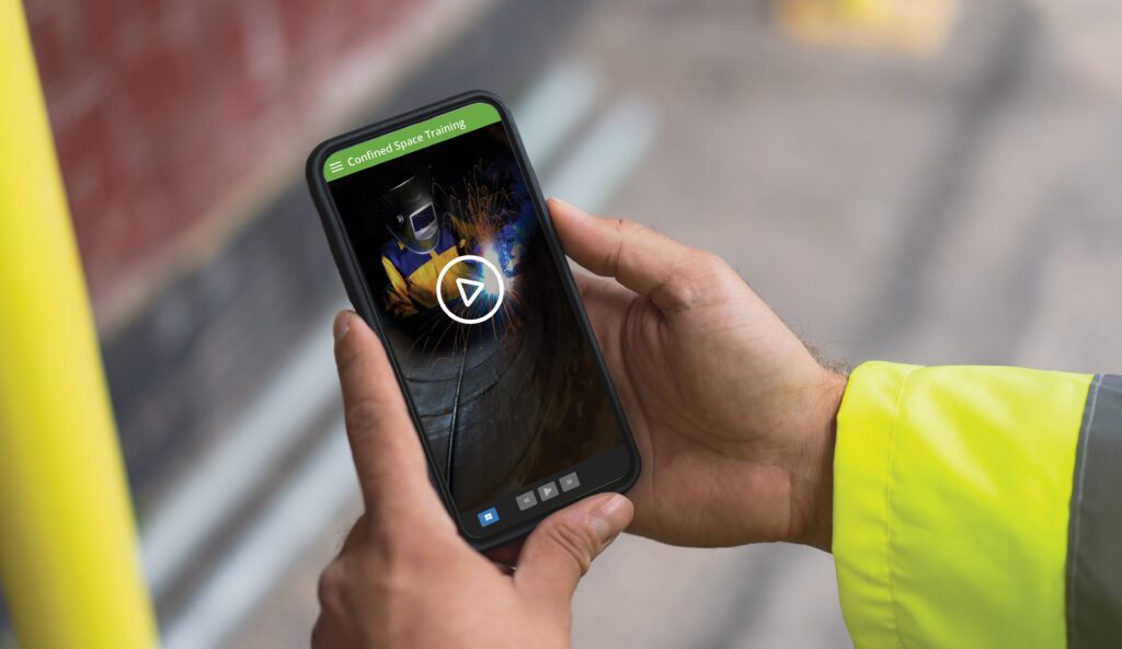 Mobile screen displaying a confined space safety training video, illustrating how EHS-LMS integration supports remote learning.