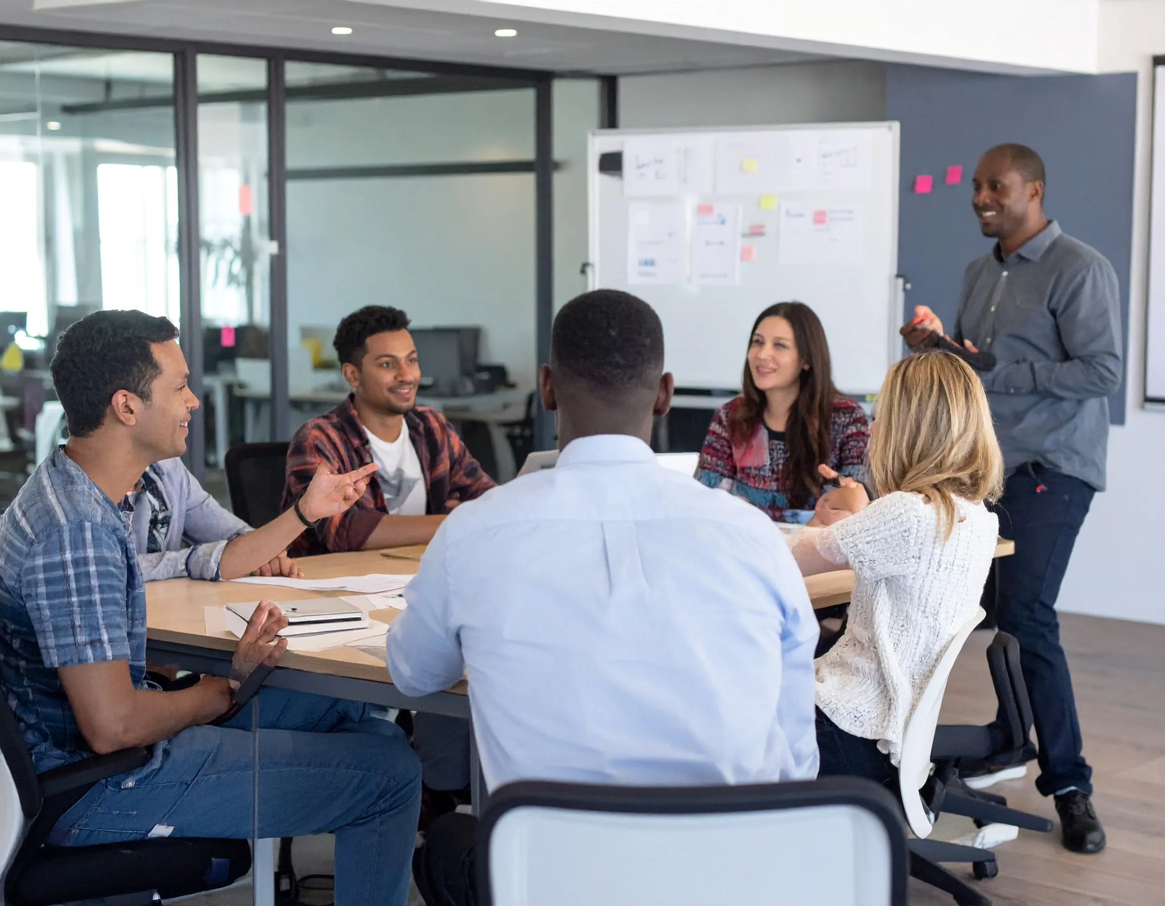 A team participating in a workplace meeting, demonstrating trust and a sense of psychological safety
