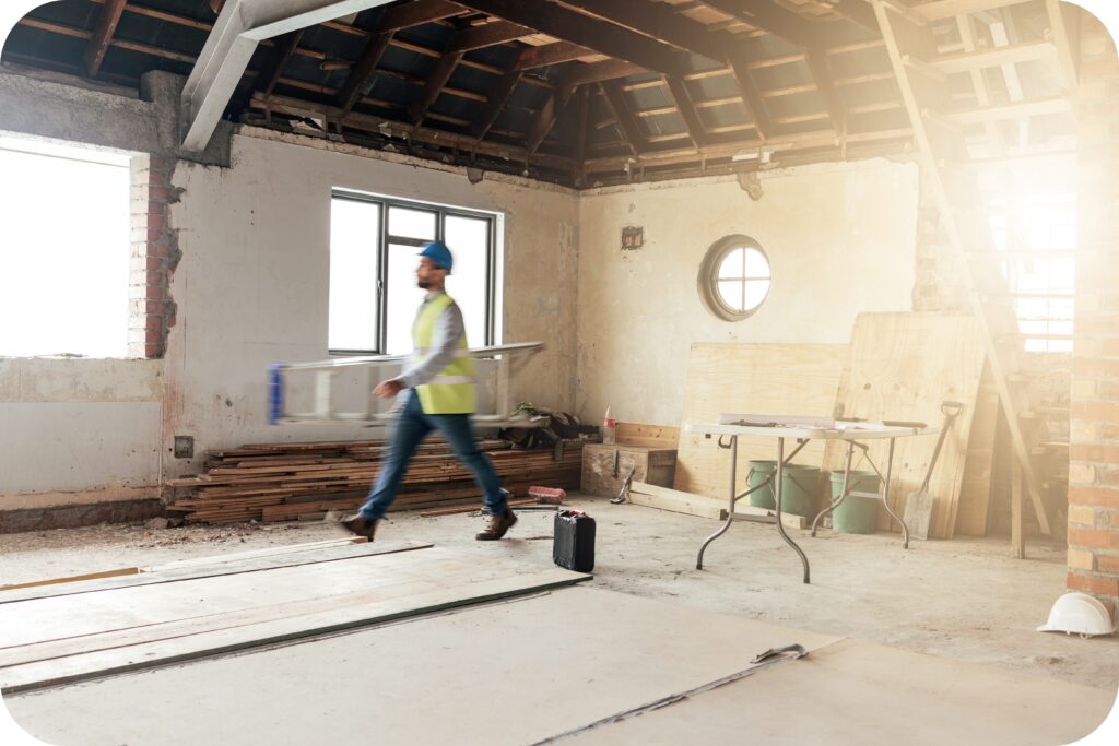 Lone construction worker operating in an unfinished building to highlight the need for safety procedures.